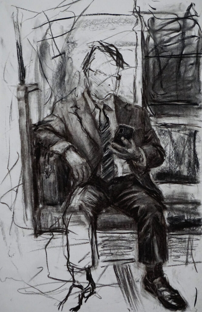 Man Looking At Phone On Subway